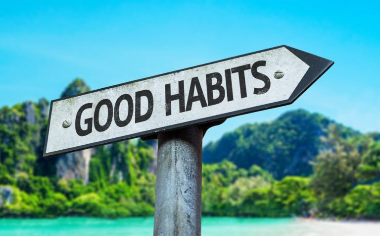 good habits sign with gorgeous beach background