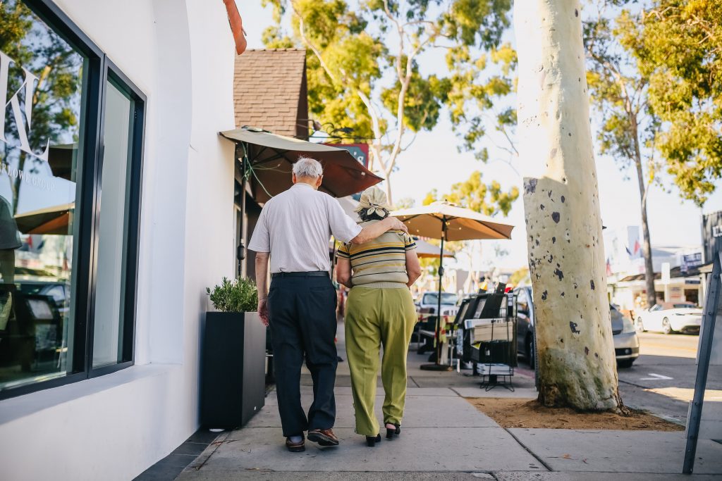 Elderly couple walking down the street